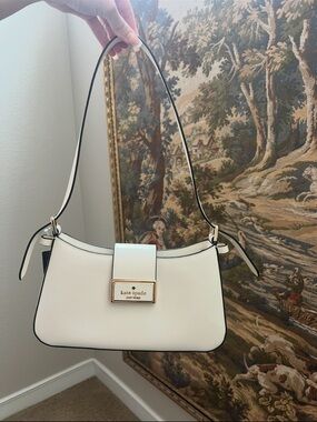 kate spade Cream Shoulder Bag with Gold Logo Plaque and Black Piping